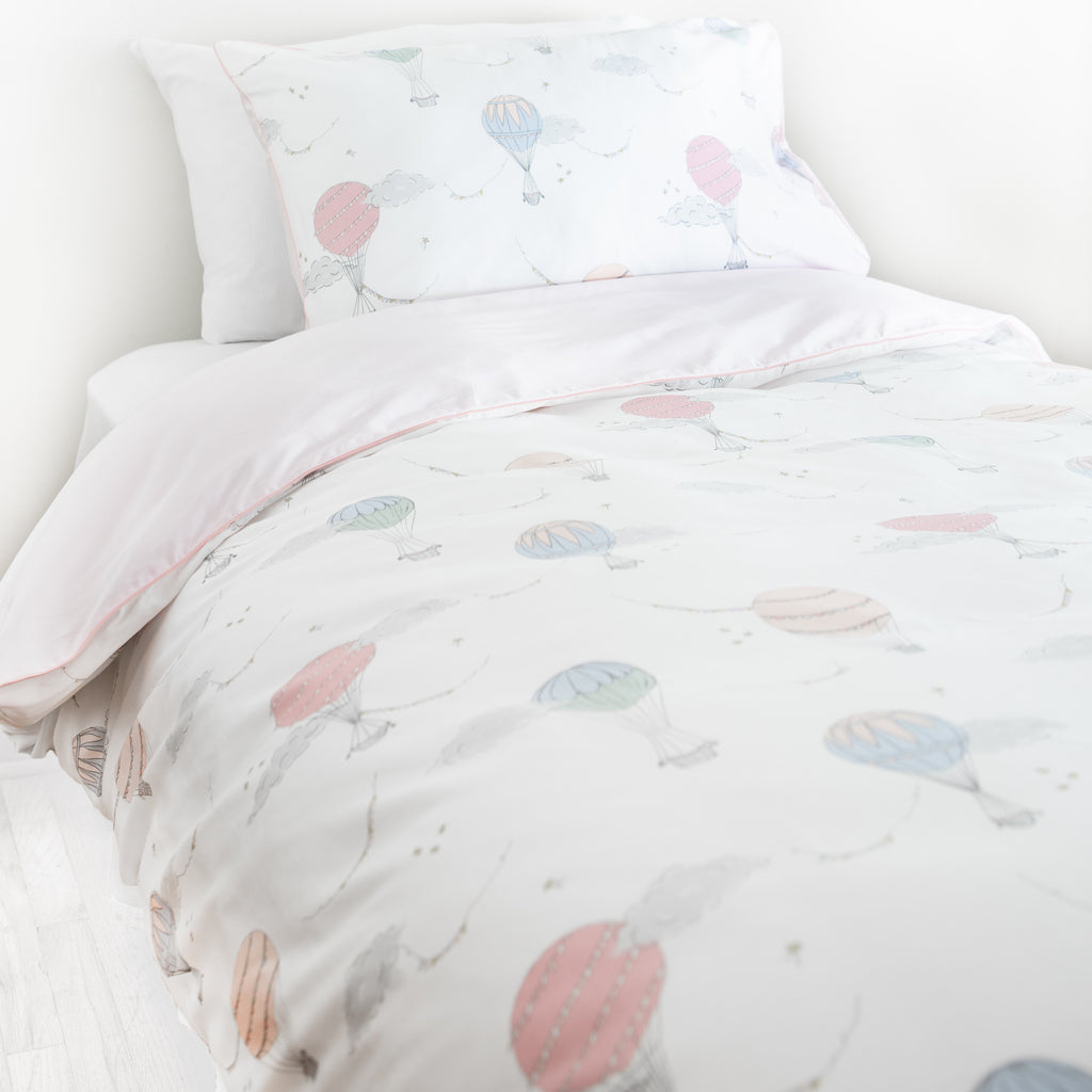 Twin duvet sheet set in the "Touch The Sky" print in the color pink, the set includes a duvet cover and a standard pillowcase