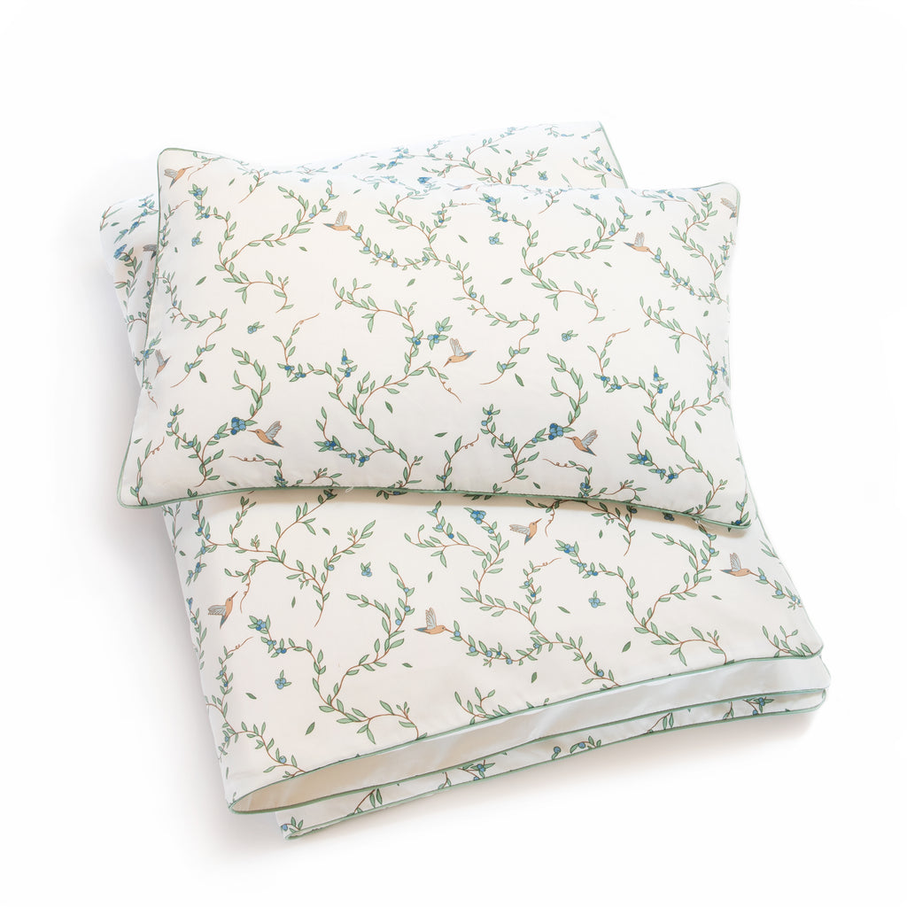 Toddler duvet in the "Secret Garden" print in the color ivory, with the matching toddler pillow