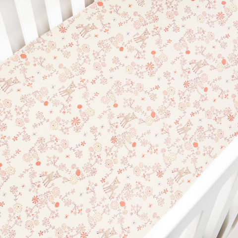 Crib Sheet in "Into The Woodlands" print in the color ivory featured in a crib