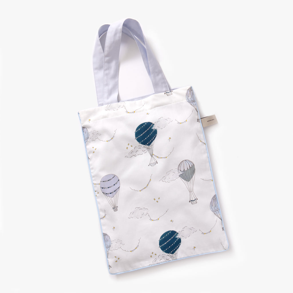 Printed tote bag is included with bedding in "Touch The Sky" print in the color blue