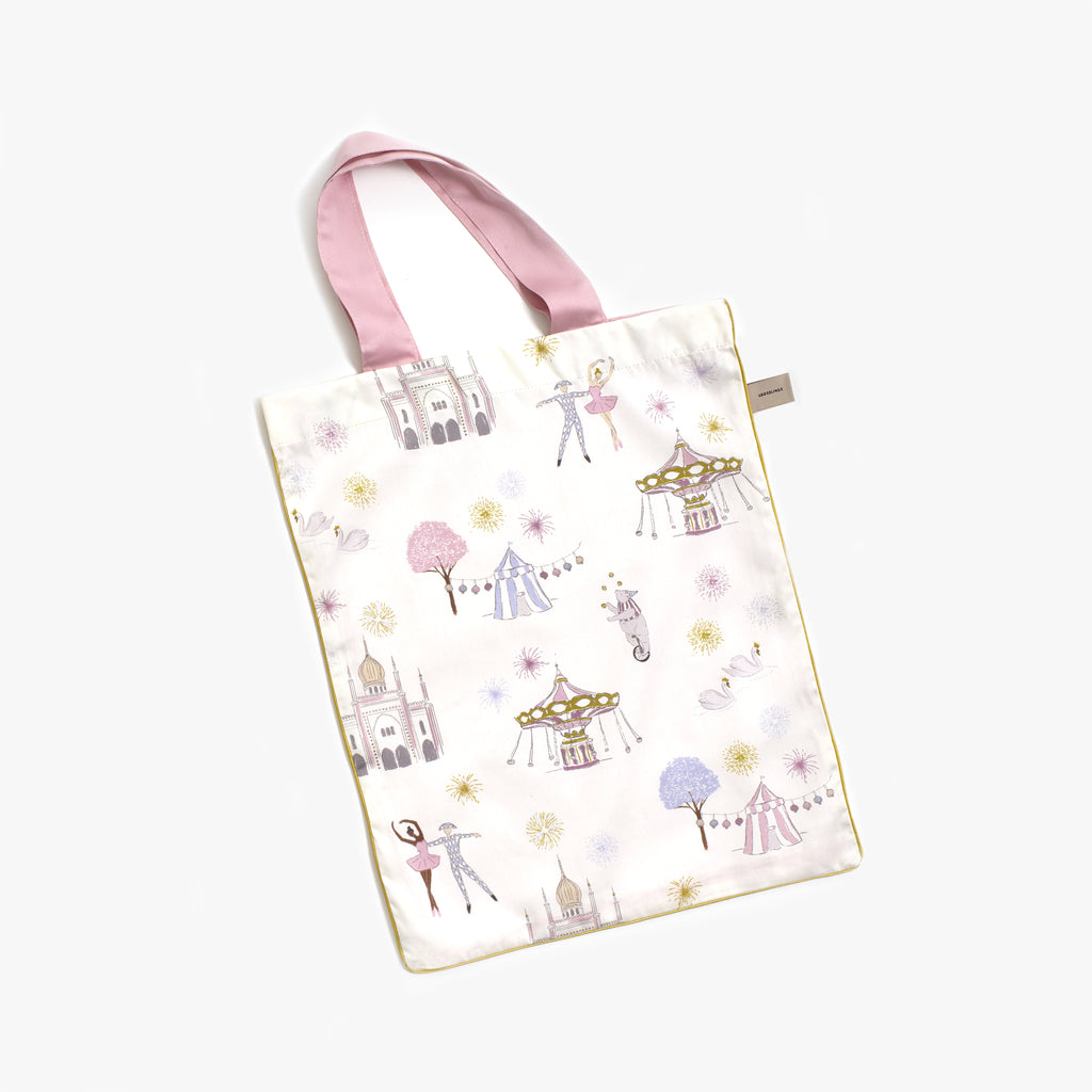 Printed tote bag is included with the bedding set in the "Adventures in Wonderland" print in the color ivory