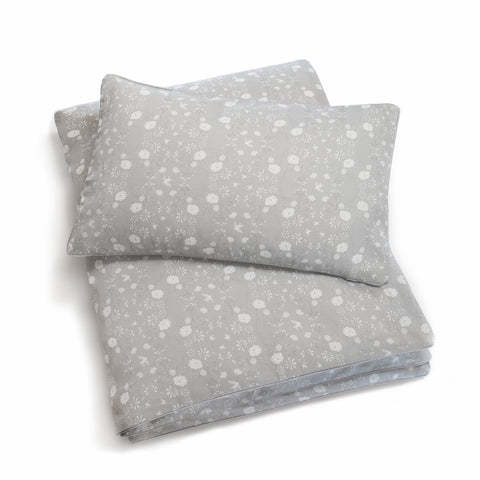 Toddler duvet in the "Bird's Song" print in the color grey, with the matching toddler pillow